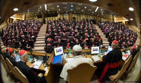 In this handout picture released by the Vatican press office, Pope Francis (C) attends the Synod on the family on October 5, 2015, as cardinals and bishops gather in the Synod Aula, at the St Peter's basilica in Vatican. Pope Francis on October 4 defended marriage and heterosexual couples as he opened a synod on the family overshadowed by a challenge to Vatican orthodoxy by a gay priest.    AFP PHOTO / OSSERVATORE ROMANO RESTRICTED TO EDITORIAL USE - MANDATORY CREDIT "AFP PHOTO / OSSERVATORE ROMANO" - NO MARKETING NO ADVERTISING CAMPAIGNS - DISTRIBUTED AS A SERVICE TO CLIENTS